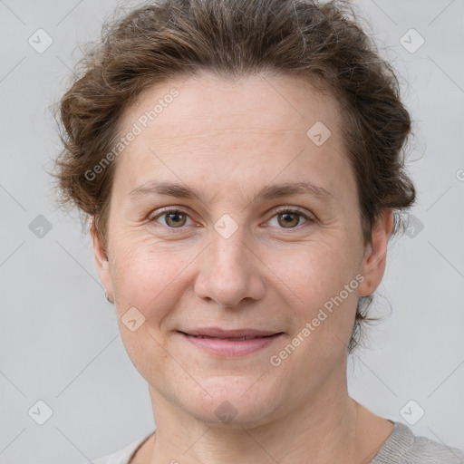 Joyful white adult female with short  brown hair and grey eyes