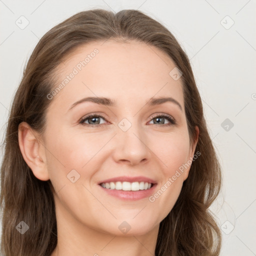 Joyful white young-adult female with long  brown hair and grey eyes