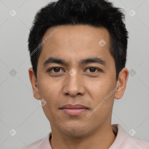 Joyful latino young-adult male with short  black hair and brown eyes