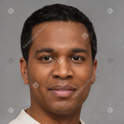 Joyful latino young-adult male with short  brown hair and brown eyes