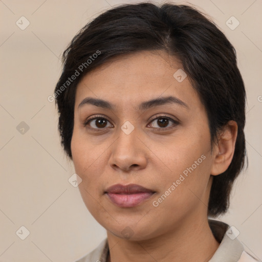 Joyful latino young-adult female with medium  brown hair and brown eyes