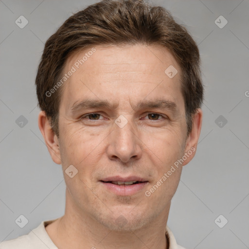 Joyful white adult male with short  brown hair and grey eyes