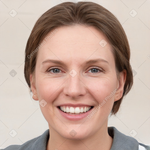 Joyful white young-adult female with short  brown hair and grey eyes