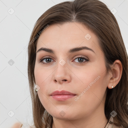 Neutral white young-adult female with long  brown hair and brown eyes