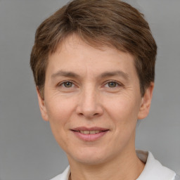 Joyful white adult female with short  brown hair and brown eyes