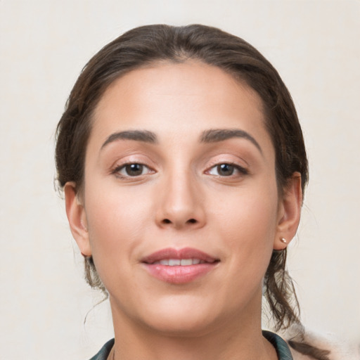 Joyful white young-adult female with medium  brown hair and brown eyes