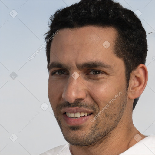 Joyful white adult male with short  black hair and brown eyes