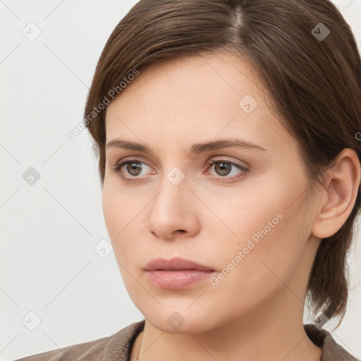 Neutral white young-adult female with medium  brown hair and brown eyes