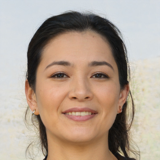 Joyful asian young-adult female with medium  brown hair and brown eyes