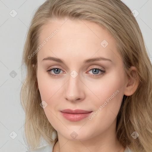 Joyful white young-adult female with long  brown hair and blue eyes