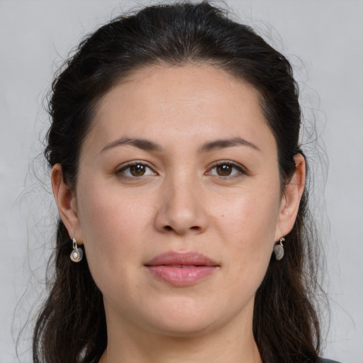 Joyful white young-adult female with long  brown hair and brown eyes