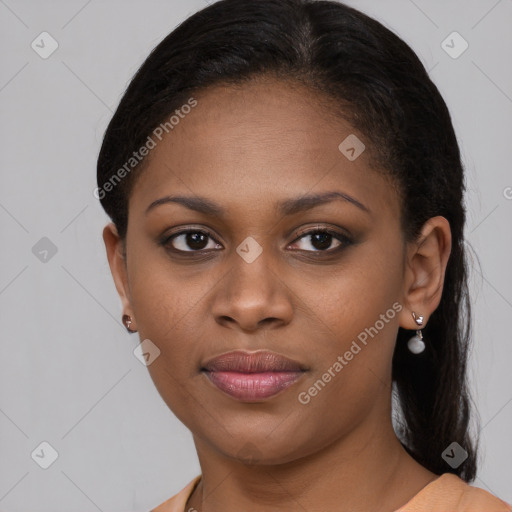 Joyful black young-adult female with medium  brown hair and brown eyes