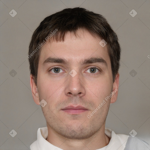 Neutral white young-adult male with short  brown hair and brown eyes