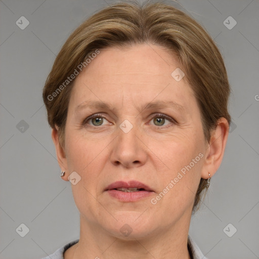 Joyful white adult female with short  brown hair and grey eyes