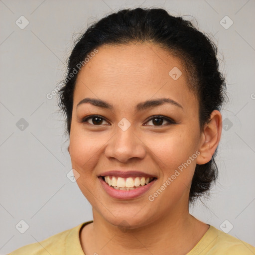 Joyful latino young-adult female with short  brown hair and brown eyes