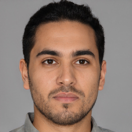 Neutral latino young-adult male with short  black hair and brown eyes
