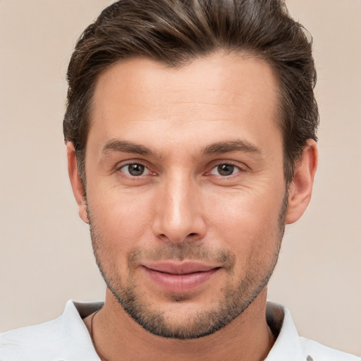 Joyful white young-adult male with short  brown hair and brown eyes