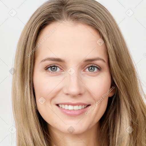 Joyful white young-adult female with long  brown hair and green eyes