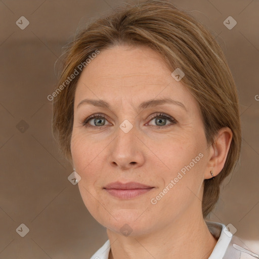 Joyful white adult female with medium  brown hair and green eyes