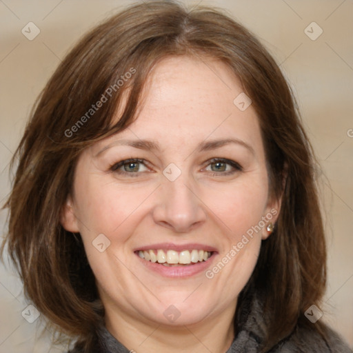 Joyful white adult female with medium  brown hair and grey eyes