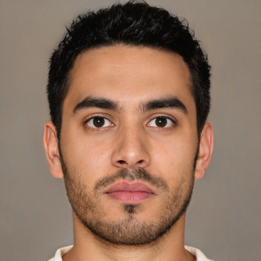 Neutral latino young-adult male with short  black hair and brown eyes
