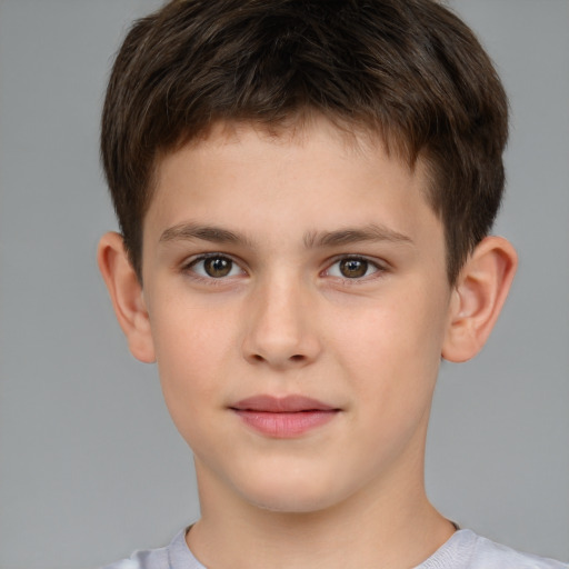 Joyful white child male with short  brown hair and brown eyes