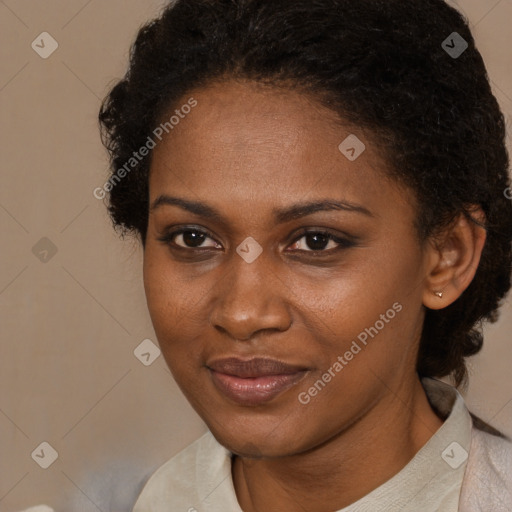 Joyful black adult female with short  brown hair and brown eyes