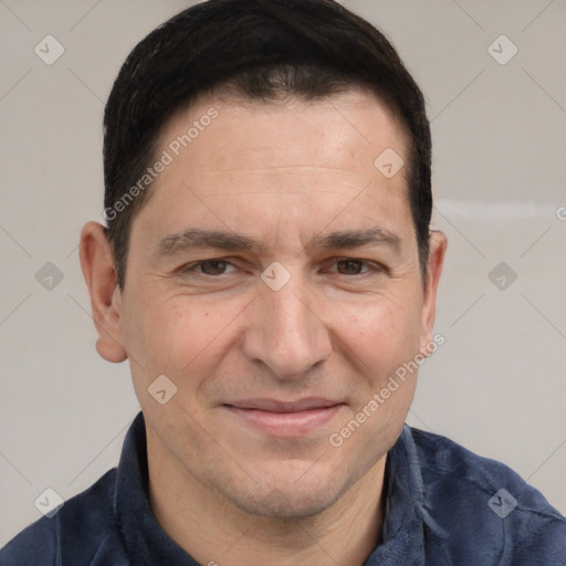 Joyful white adult male with short  brown hair and brown eyes