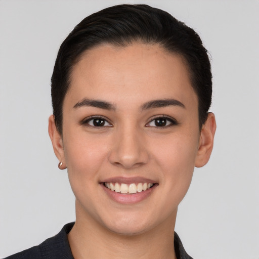 Joyful white young-adult female with short  brown hair and brown eyes