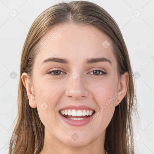 Joyful white young-adult female with long  brown hair and grey eyes