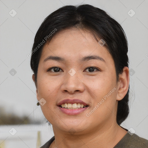 Joyful asian young-adult female with short  brown hair and brown eyes