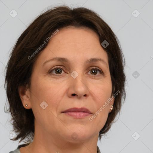 Joyful white adult female with medium  brown hair and brown eyes