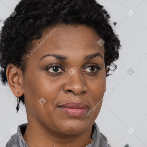 Joyful black adult female with short  brown hair and brown eyes