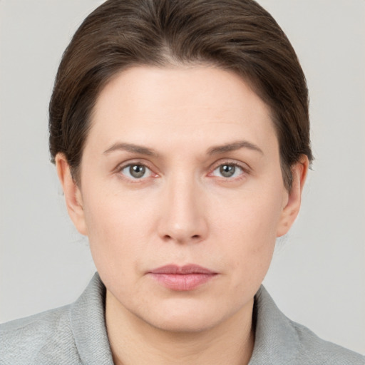 Neutral white young-adult female with short  brown hair and brown eyes