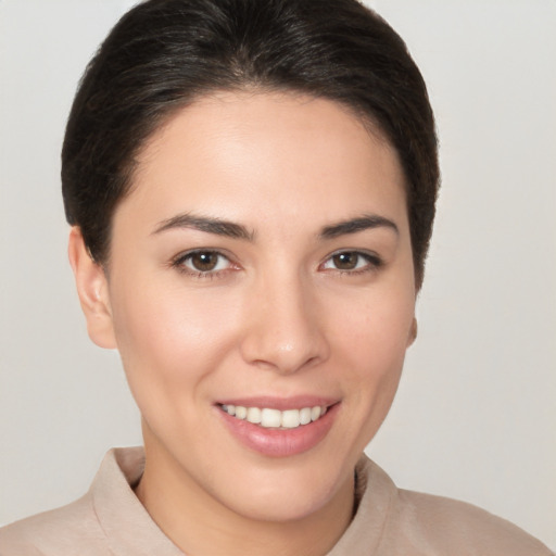 Joyful white young-adult female with medium  brown hair and brown eyes