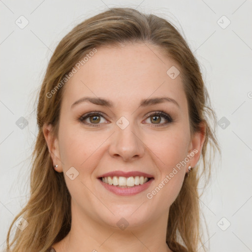 Joyful white young-adult female with long  brown hair and green eyes