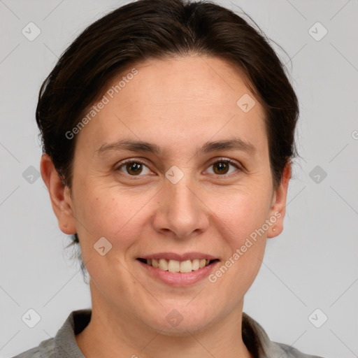 Joyful white adult female with short  brown hair and grey eyes