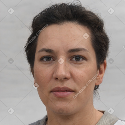 Joyful white adult female with short  brown hair and brown eyes