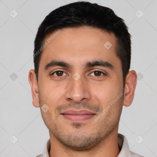 Joyful white young-adult male with short  black hair and brown eyes