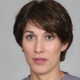 Neutral white adult female with medium  brown hair and grey eyes