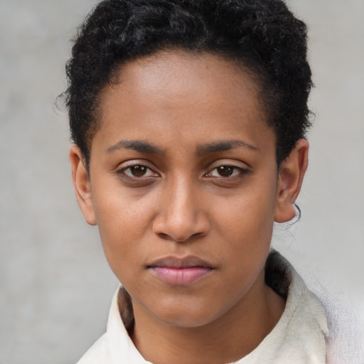 Neutral black young-adult female with short  brown hair and brown eyes