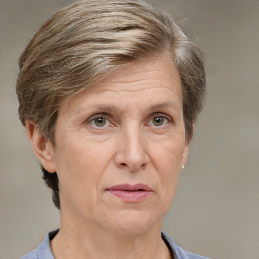 Joyful white middle-aged female with short  brown hair and grey eyes