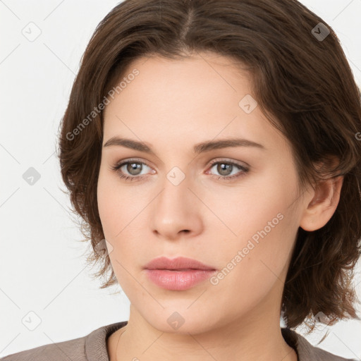 Neutral white young-adult female with medium  brown hair and brown eyes