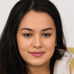 Joyful asian young-adult female with long  brown hair and brown eyes