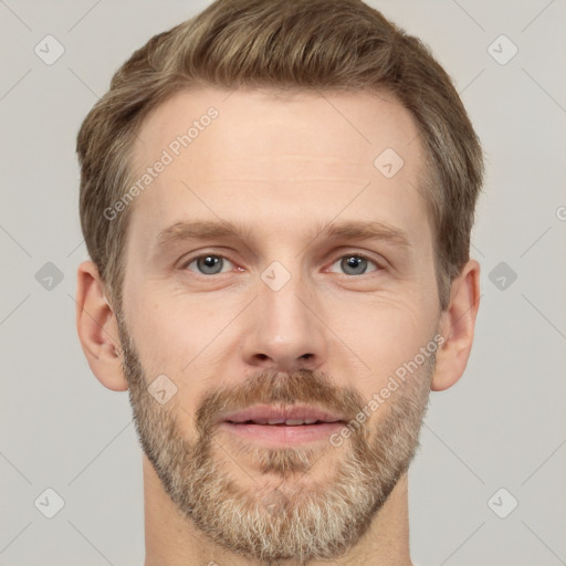 Joyful white adult male with short  brown hair and grey eyes