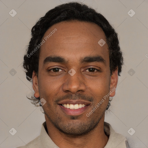 Joyful black young-adult male with short  black hair and brown eyes