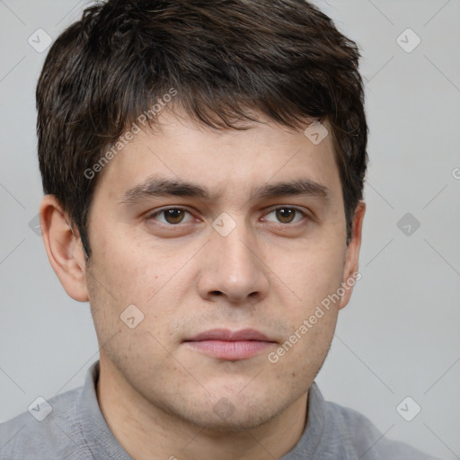 Neutral white young-adult male with short  brown hair and brown eyes