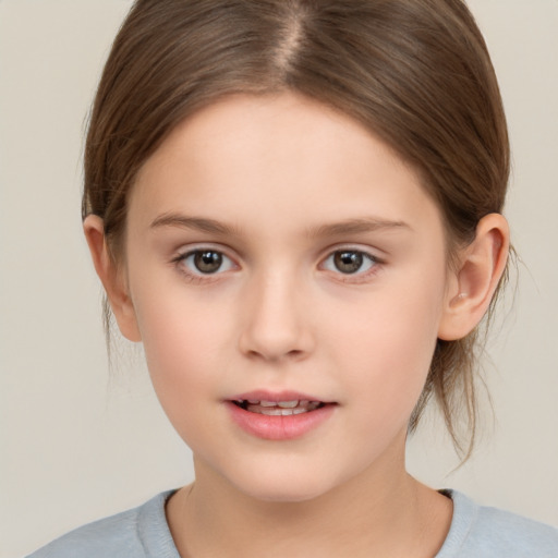 Joyful white child female with medium  brown hair and brown eyes