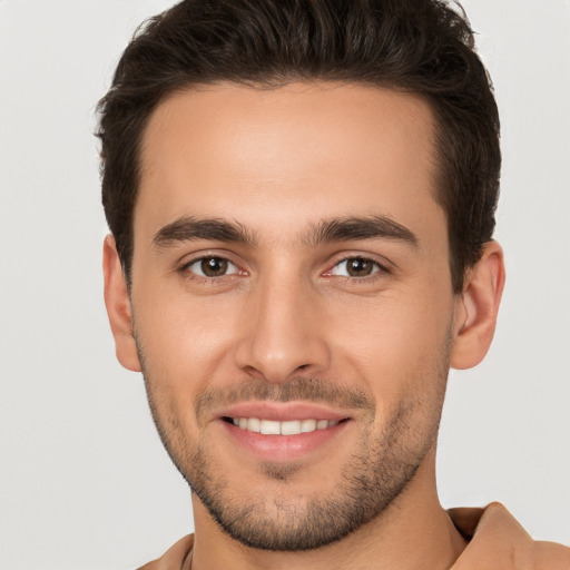 Joyful white young-adult male with short  brown hair and brown eyes