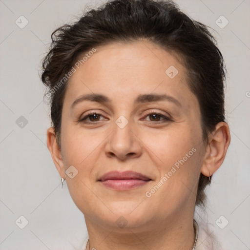 Joyful white adult female with short  brown hair and brown eyes